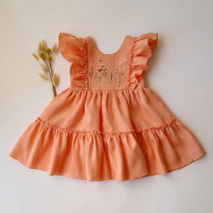 Peach Linen Ruffled Front Tiered Dress with “Meadow Flowers with Bee” Embroidery