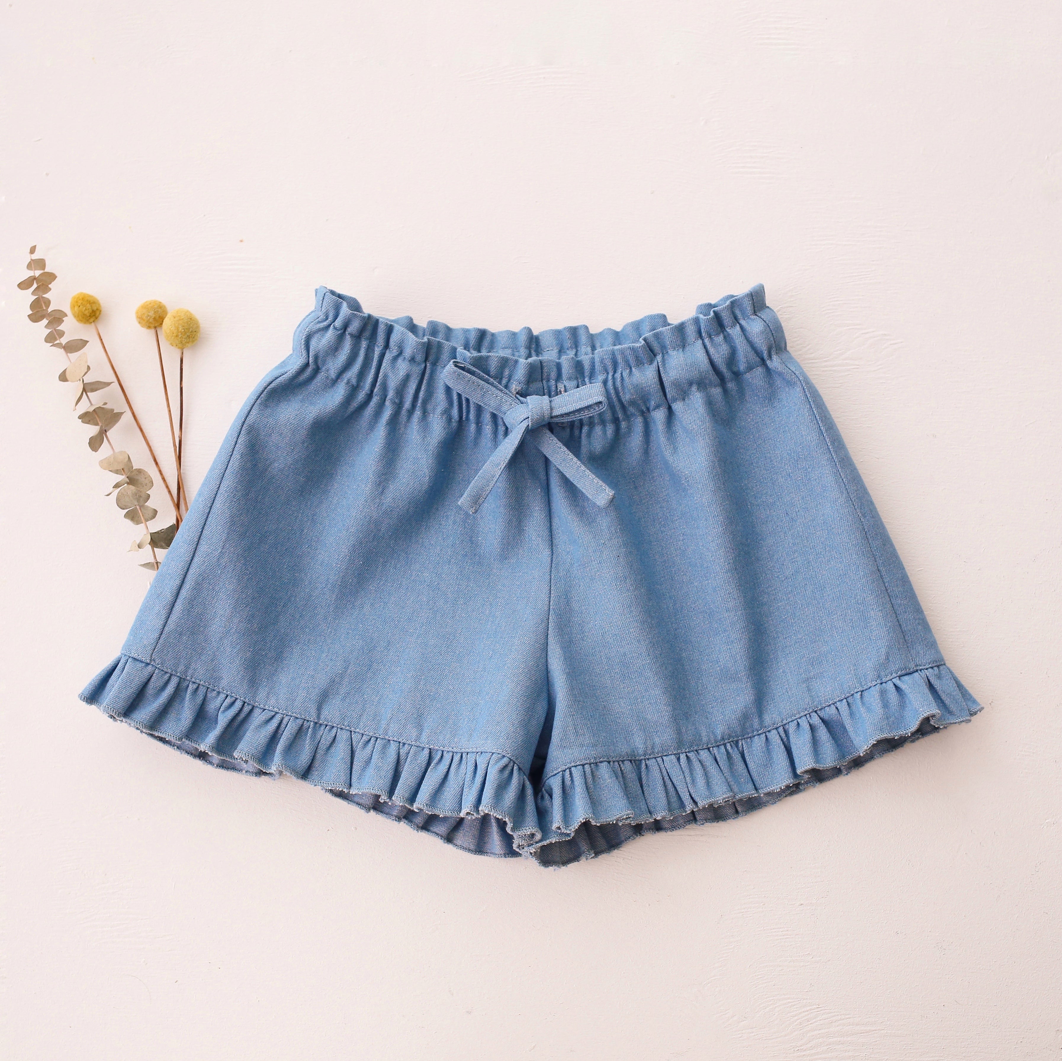 Light Denim Ruffle Shorts
