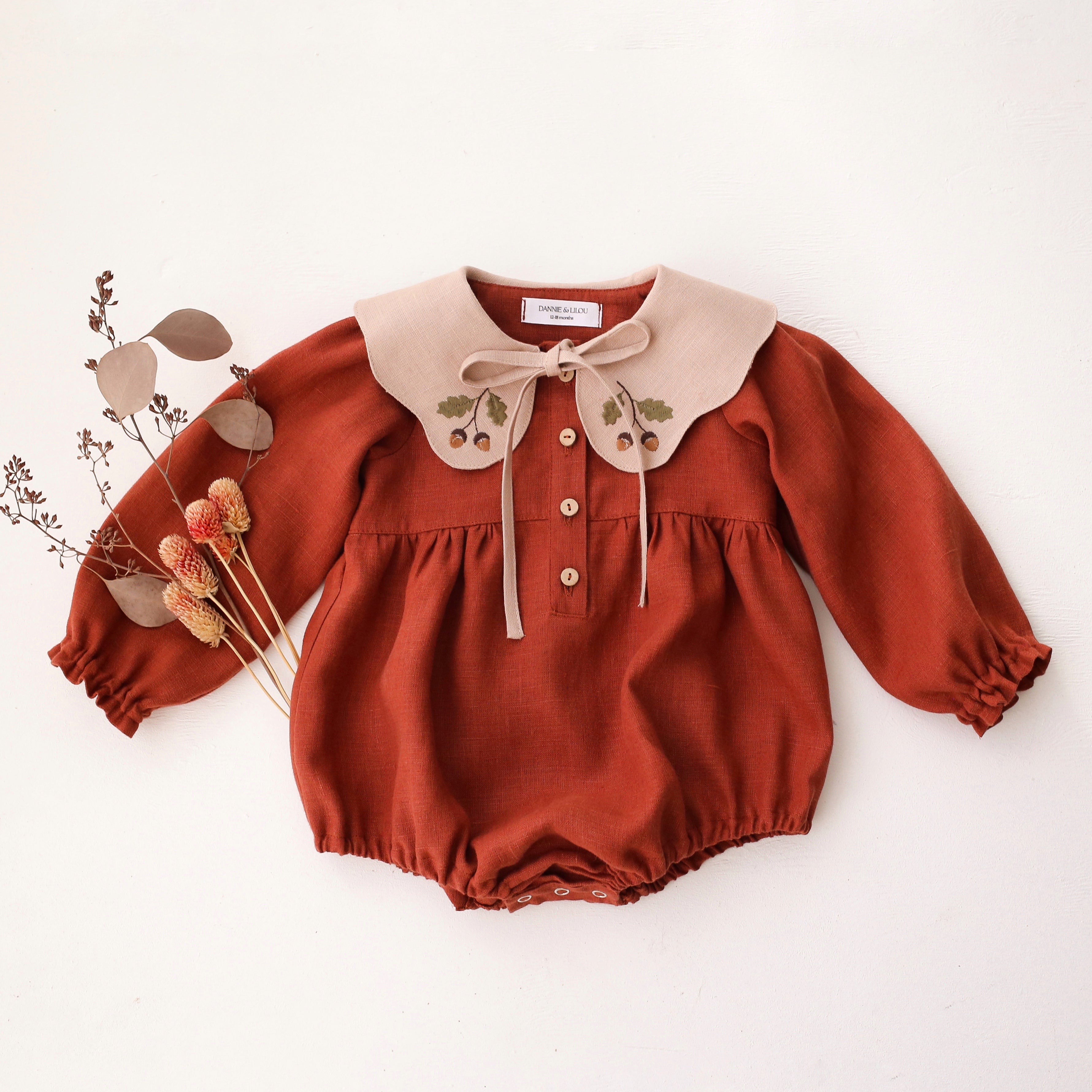 Rust Linen Long Sleeve Bubble Playsuit with Petal Collar in Beige Linen with “Mini Acorns” Embroidery