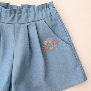 Light Denim Paperbag Waist Shorts with "Wild Bells" Embroidery