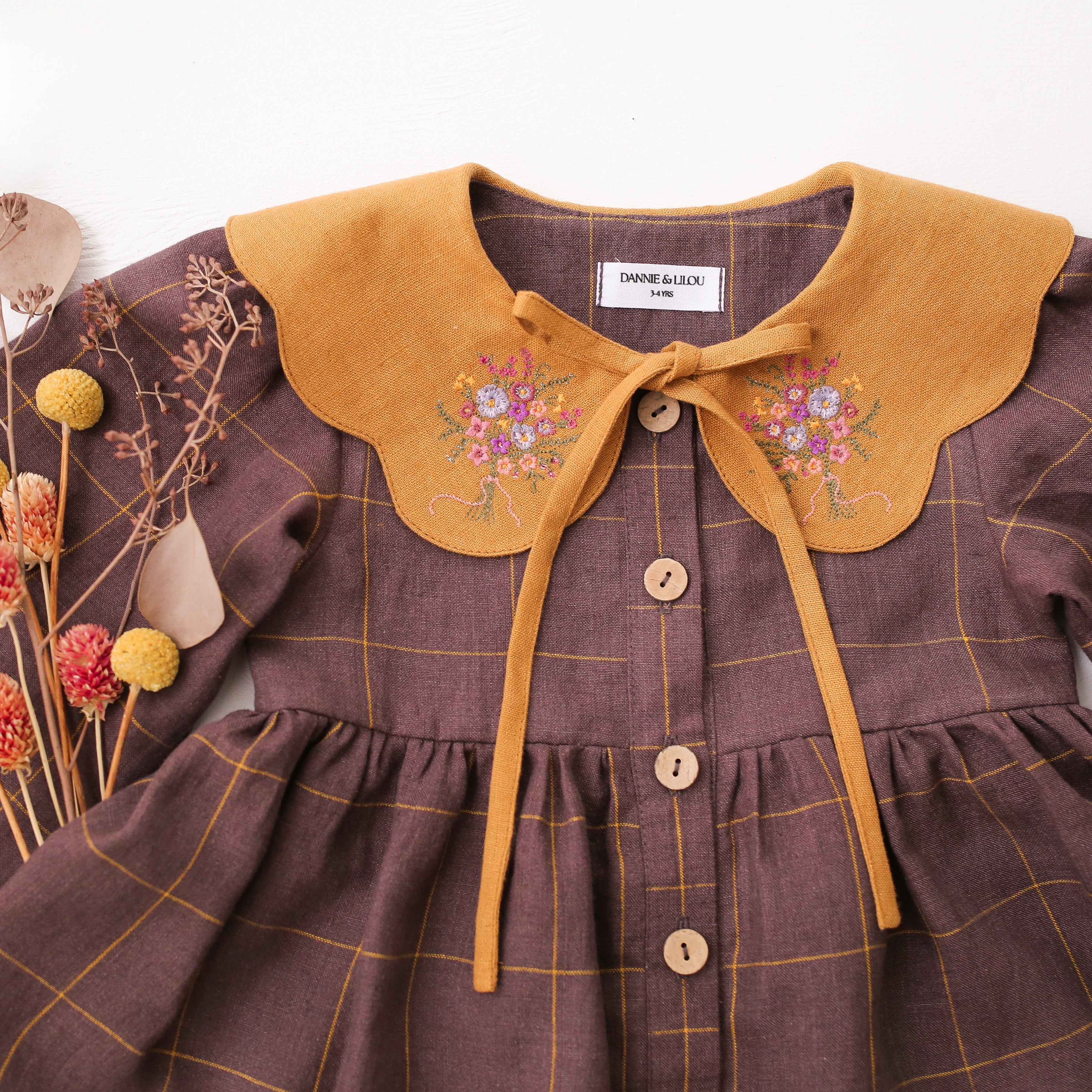 Plum Check Linen Long Sleeve Tiered Dress with Petal Collar in Mustard Linen with "Wild Meadow Bouquet" Embroidery