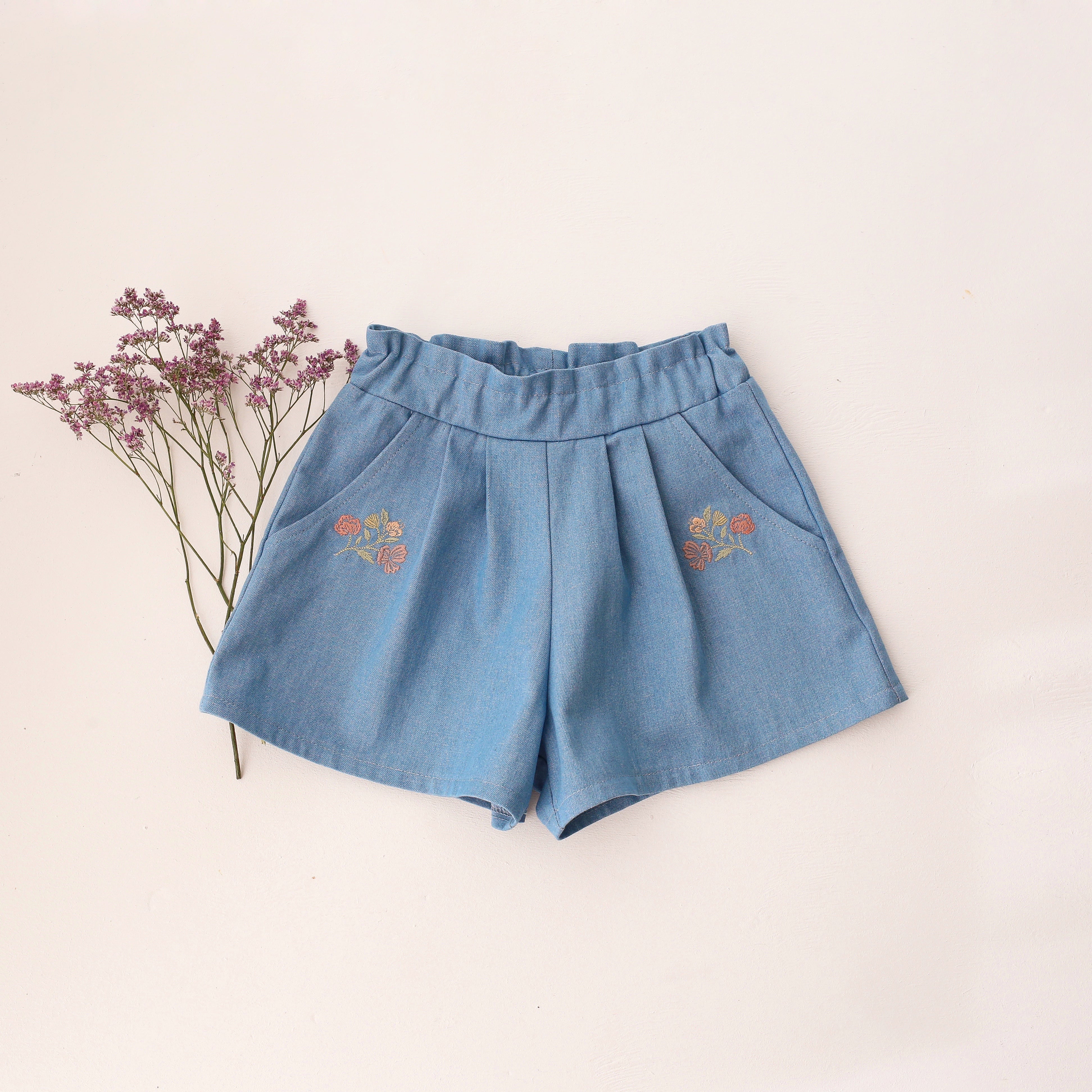Light Denim Paperbag Waist Shorts with "Wild Bells" Embroidery