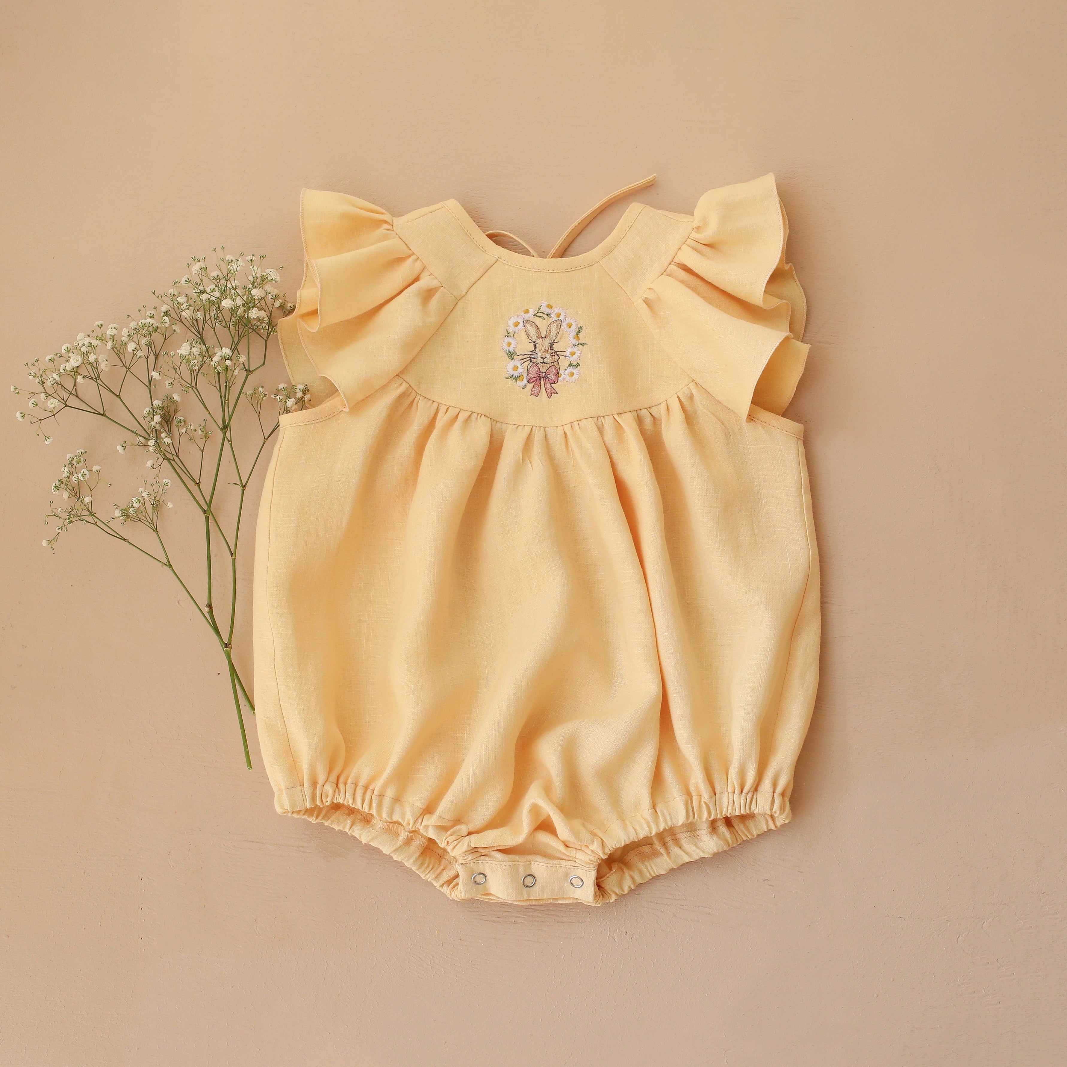 Vanilla Linen Flutter Sleeve Tie Back Bubble Playsuit with "Bunny in Daisy Wreath" Embroidery