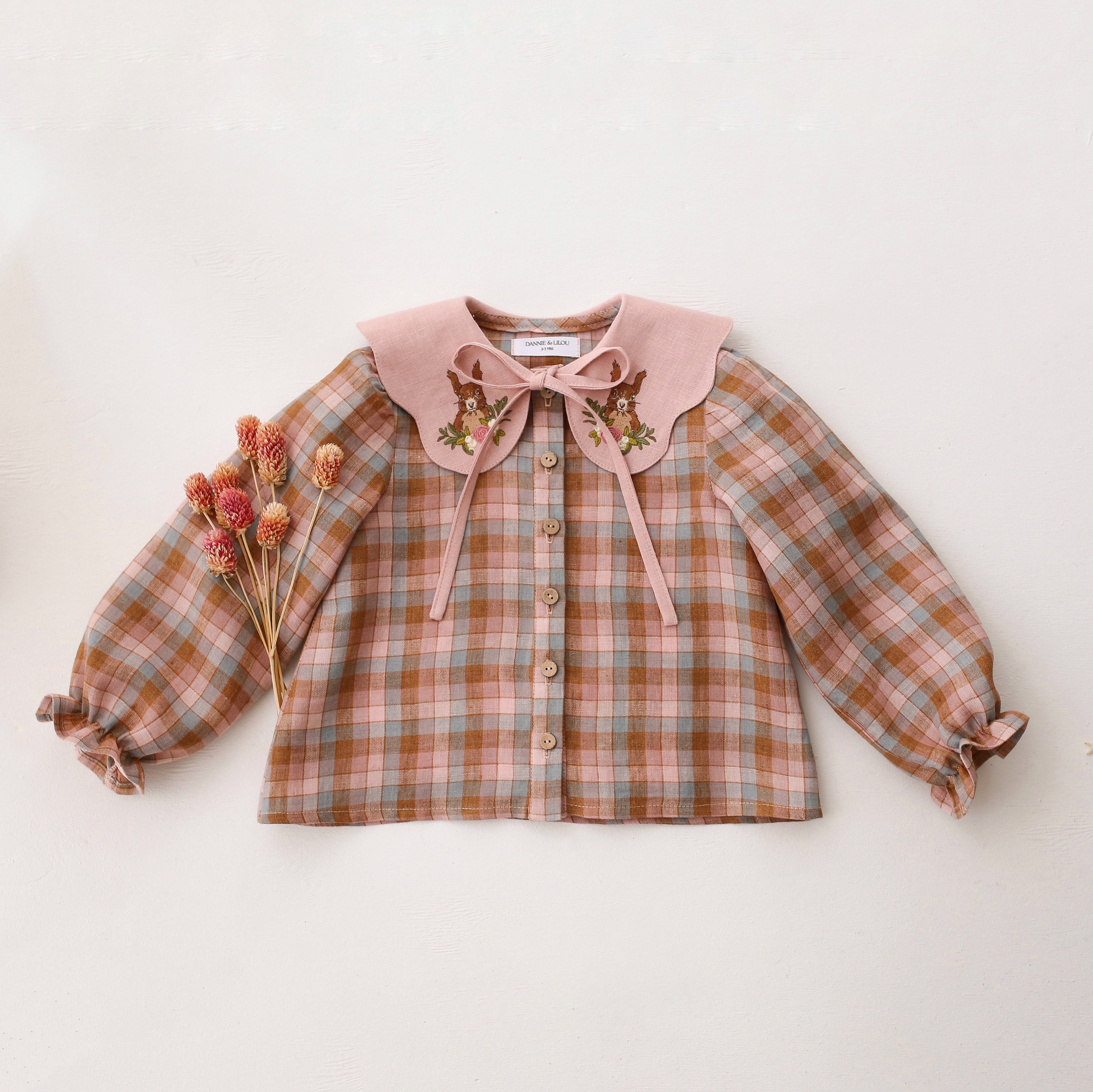 Hazel Rose Check Linen Long Sleeve Button Front Blouse with Petal Collar in Powder Linen with “Squirrel in Flowers” Embroidery
