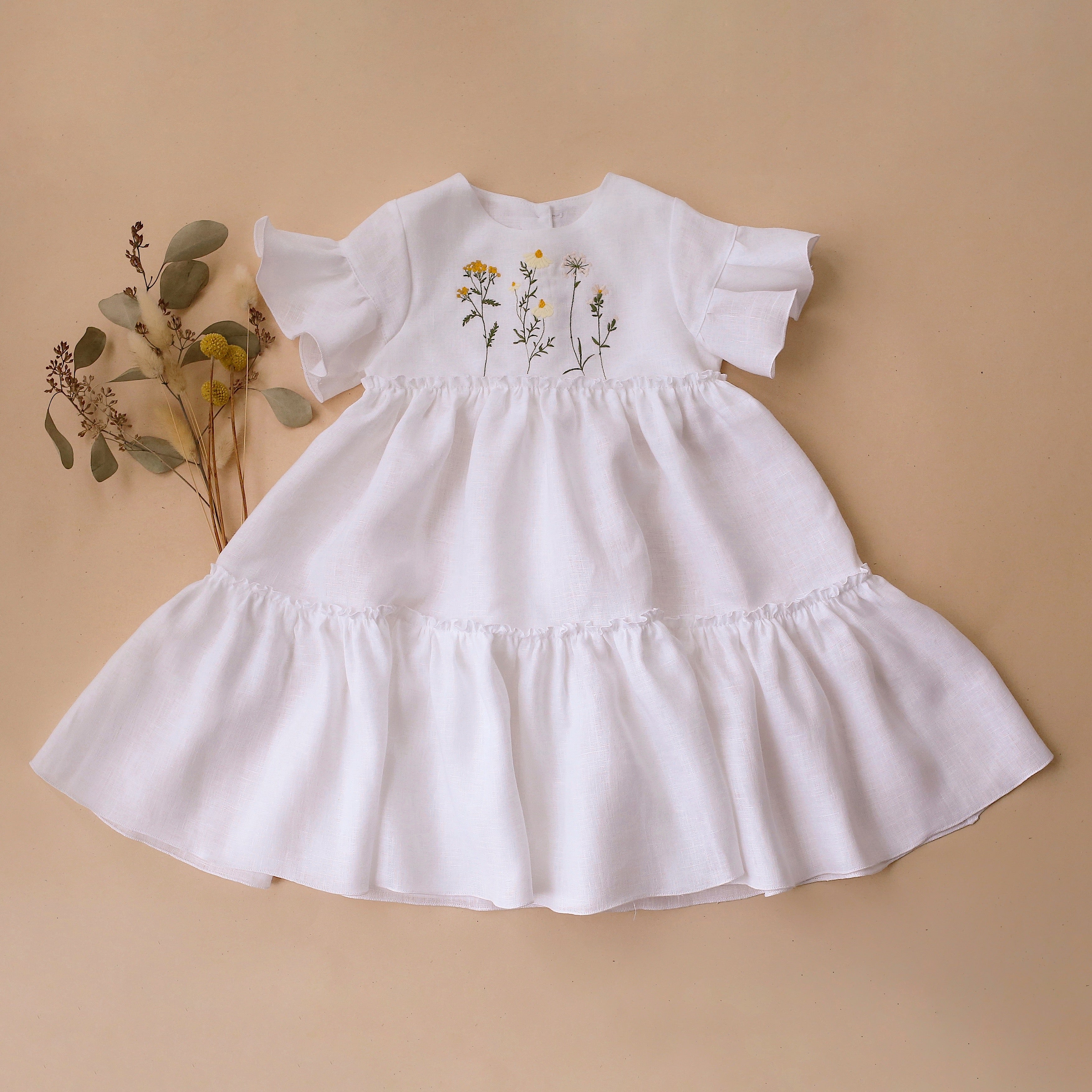 White Linen Flounce Sleeve Tiered Dress with "Chamomile Flowers" Embro Dannie and Lilou White Linen Flounce Sleeve Tiered Dress with "Chamomile Flowers" Embro Dannie and Lilou
