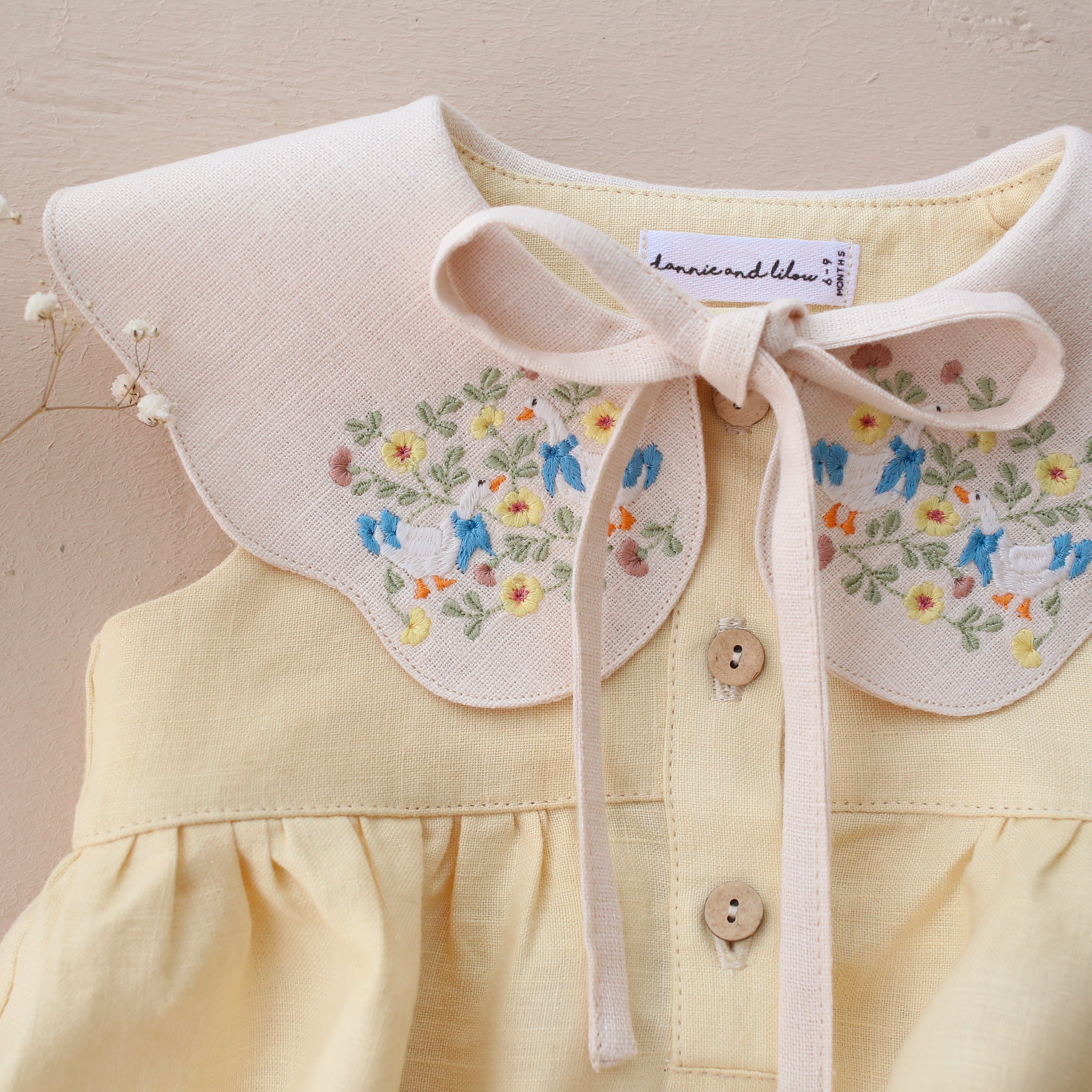 Vanilla Linen Bubble Playsuit with Petal Collar in Ivory Linen with "Geese in Flowers" Embroidery
