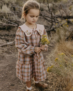 Hazel Rose Check Linen Long Sleeve Tiered Dress with Petal Collar in Powder Linen with "Bird on Berry Branch" Embroidery