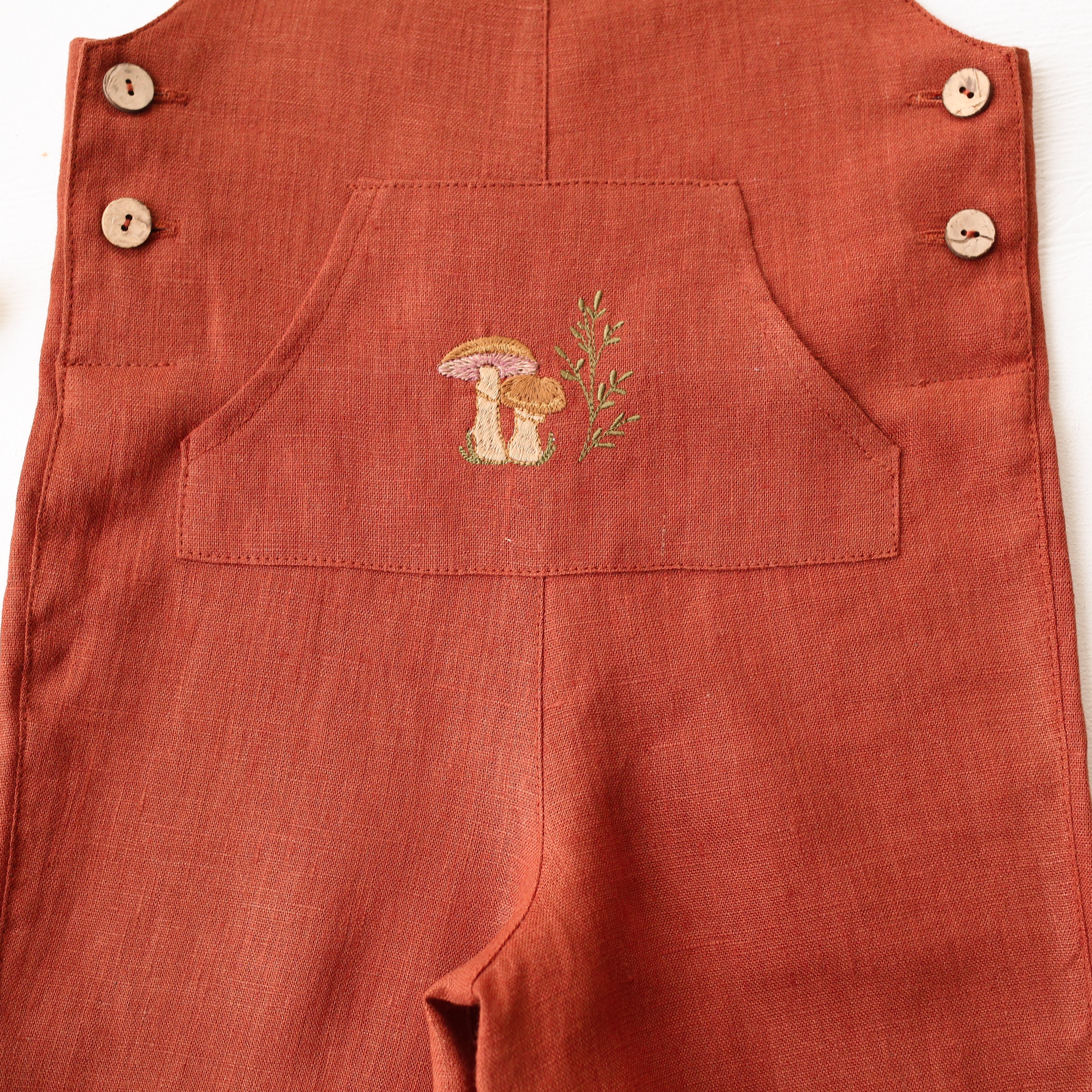 Rust Linen Kangaroo Pocket Buttoned Dungaree with "Mushrooms" Embroidery