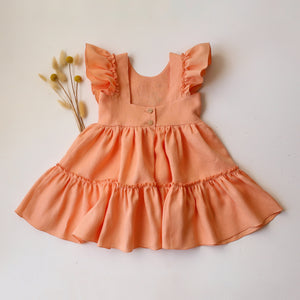 Peach Linen Ruffled Front Tiered Dress with “Meadow Flowers with Bee” Embroidery