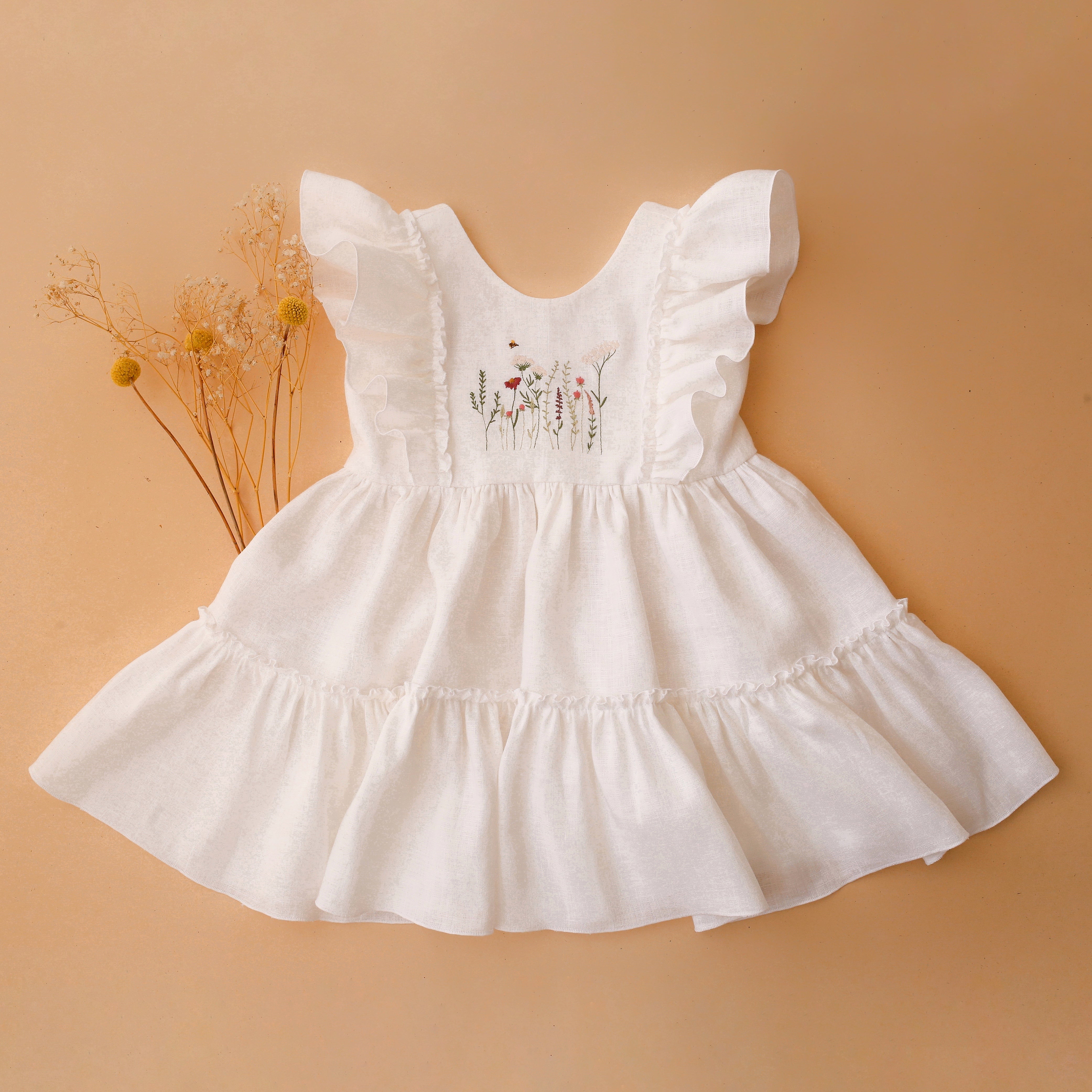 White Linen Ruffled Front Tiered Dress with Meadow Flowers with Bee Dannie and Lilou White Linen Ruffled Front Tiered Dress with Meadow Flowers with Bee Dannie and Lilou