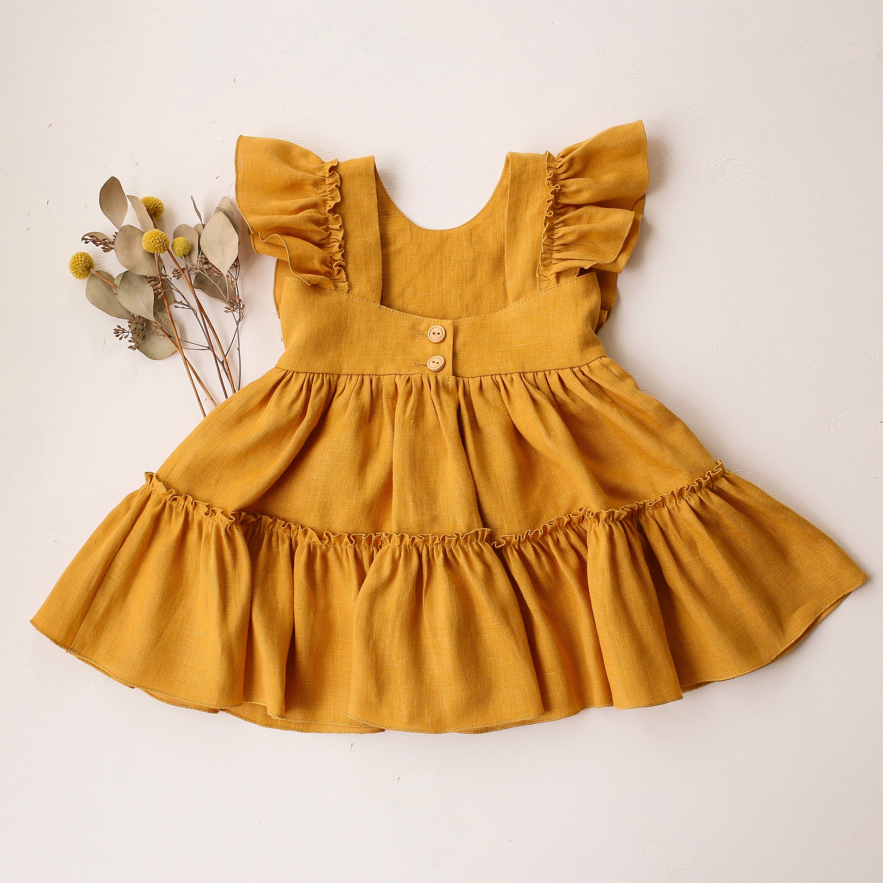 Amber Linen Ruffled Front Tiered Dress with “Meadow Flowers with Bee” Embroidery