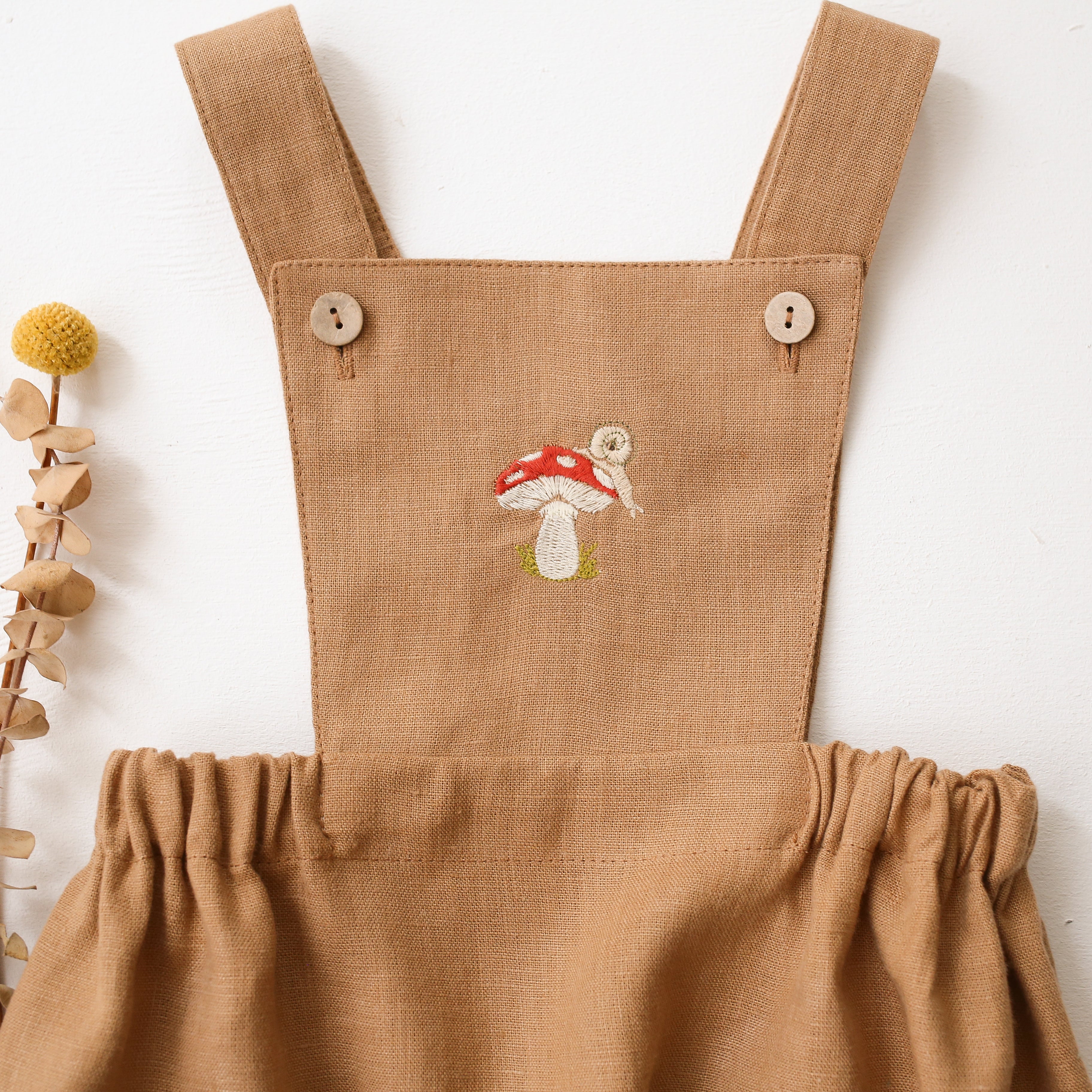 Latte Linen Pinafore Romper with “Toadstool with Snail” Embroidery