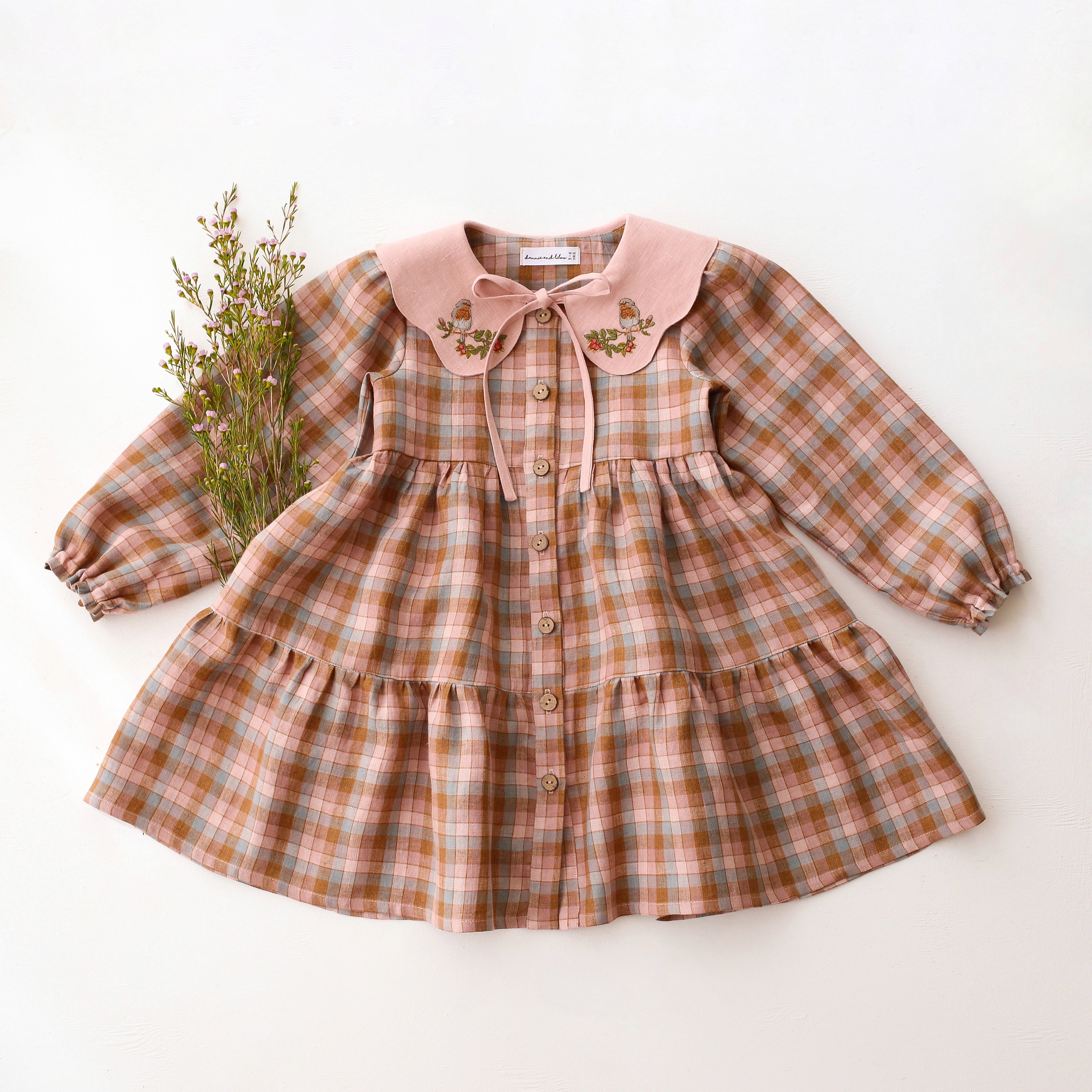 Hazel Rose Check Linen Long Sleeve Tiered Dress with Petal Collar in Powder Linen with "Bird on Berry Branch" Embroidery
