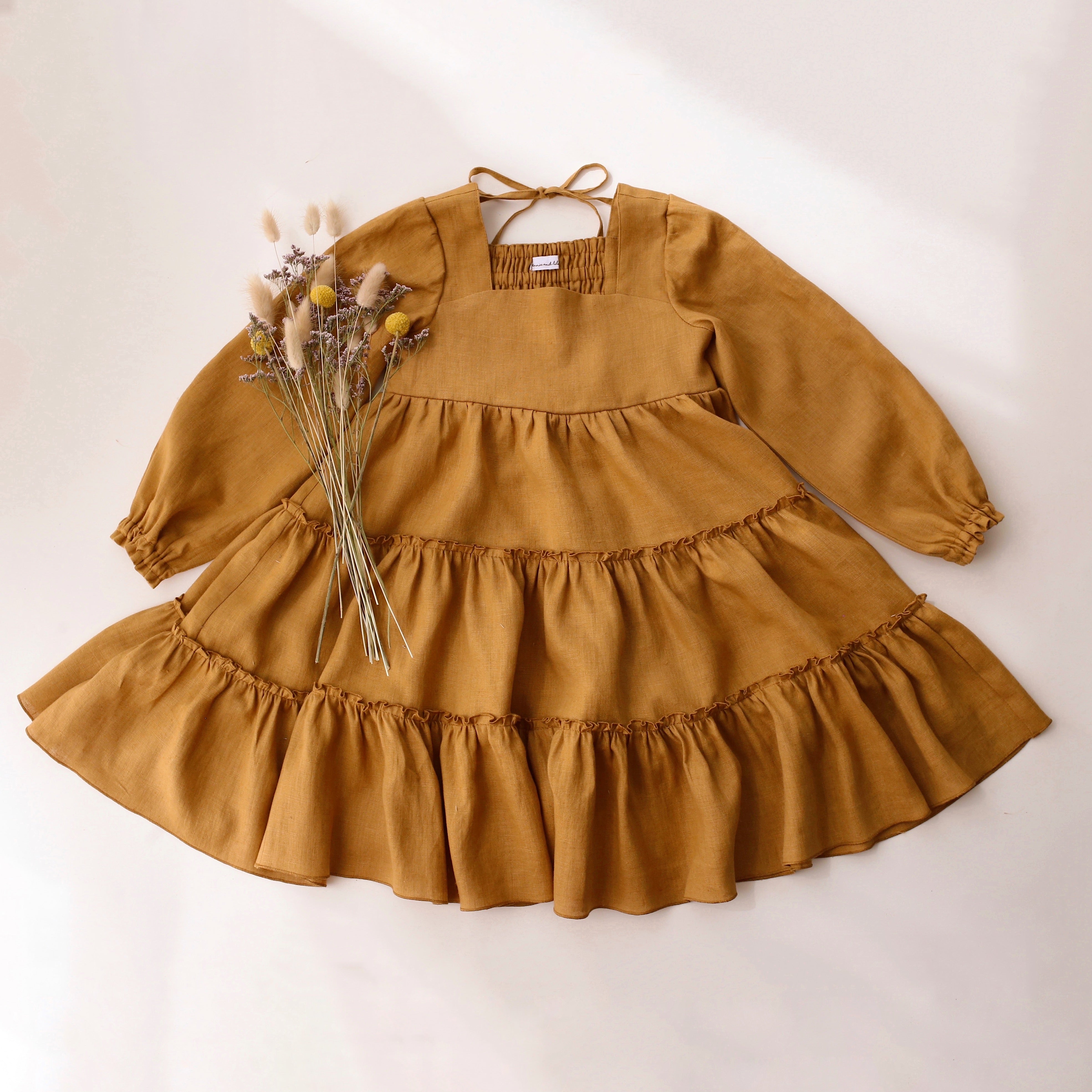Mustard Linen Long Sleeve Tiered Dress with Elastic Casing Back Dannie and Lilou Mustard Linen Long Sleeve Tiered Dress with Elastic Casing Back Dannie and Lilou